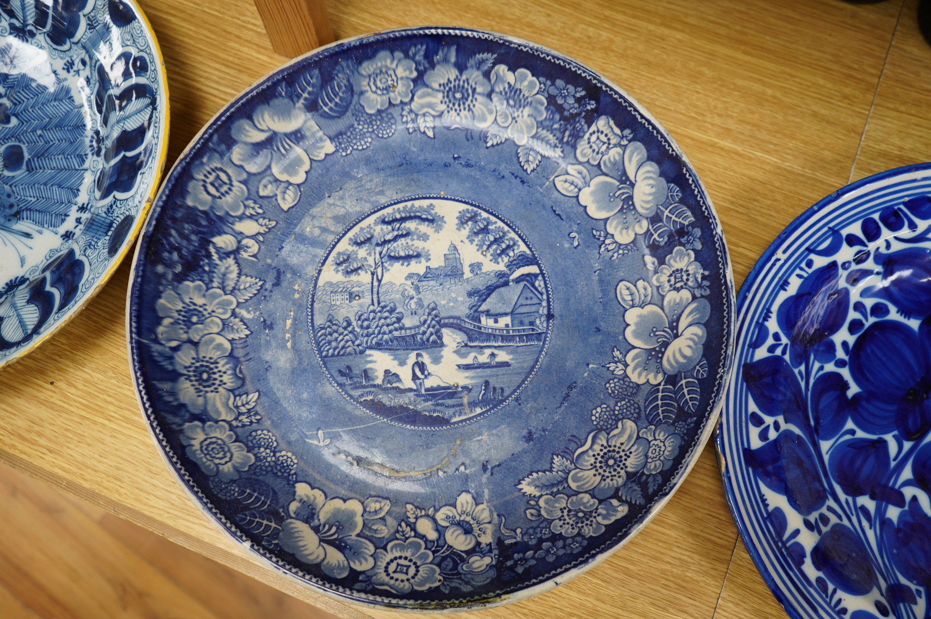 A 18th century delftware charger, another later, a Victorian Briar Rose earthenware dish and a Chinese dish, largest 35cm Condition - poor